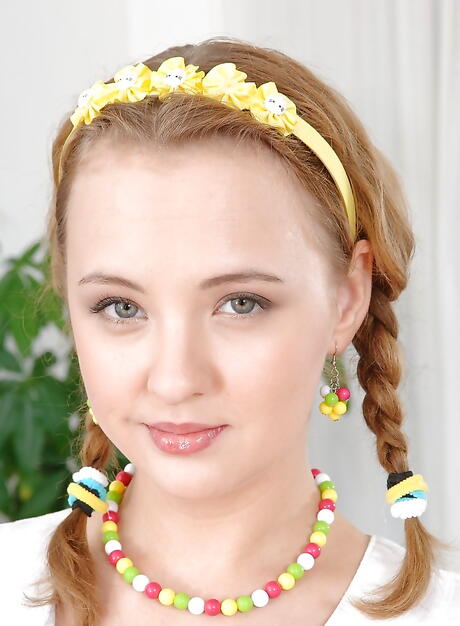 Very attractive russian teen Lolly Moon in sexy stockings bares big hooters and bald pussy in office